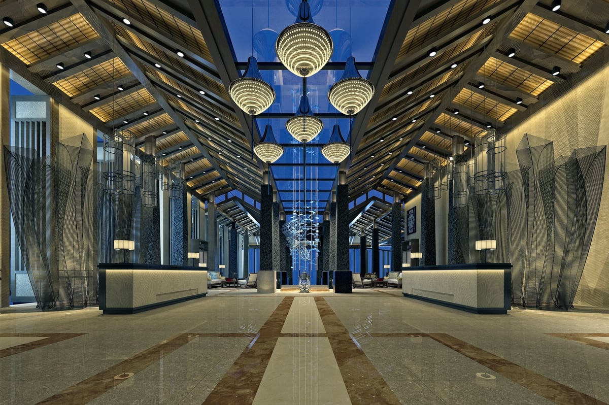 Luxury hotel lobby with polished marble floors and grand columns