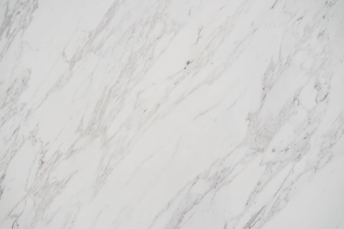 Polished white marble countertop with natural grey veining
